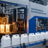 High-performance blow moulding machine running in a modern factory, showing consistent production and stable control systems by Blow Moulding Machine Manufacturers in India.